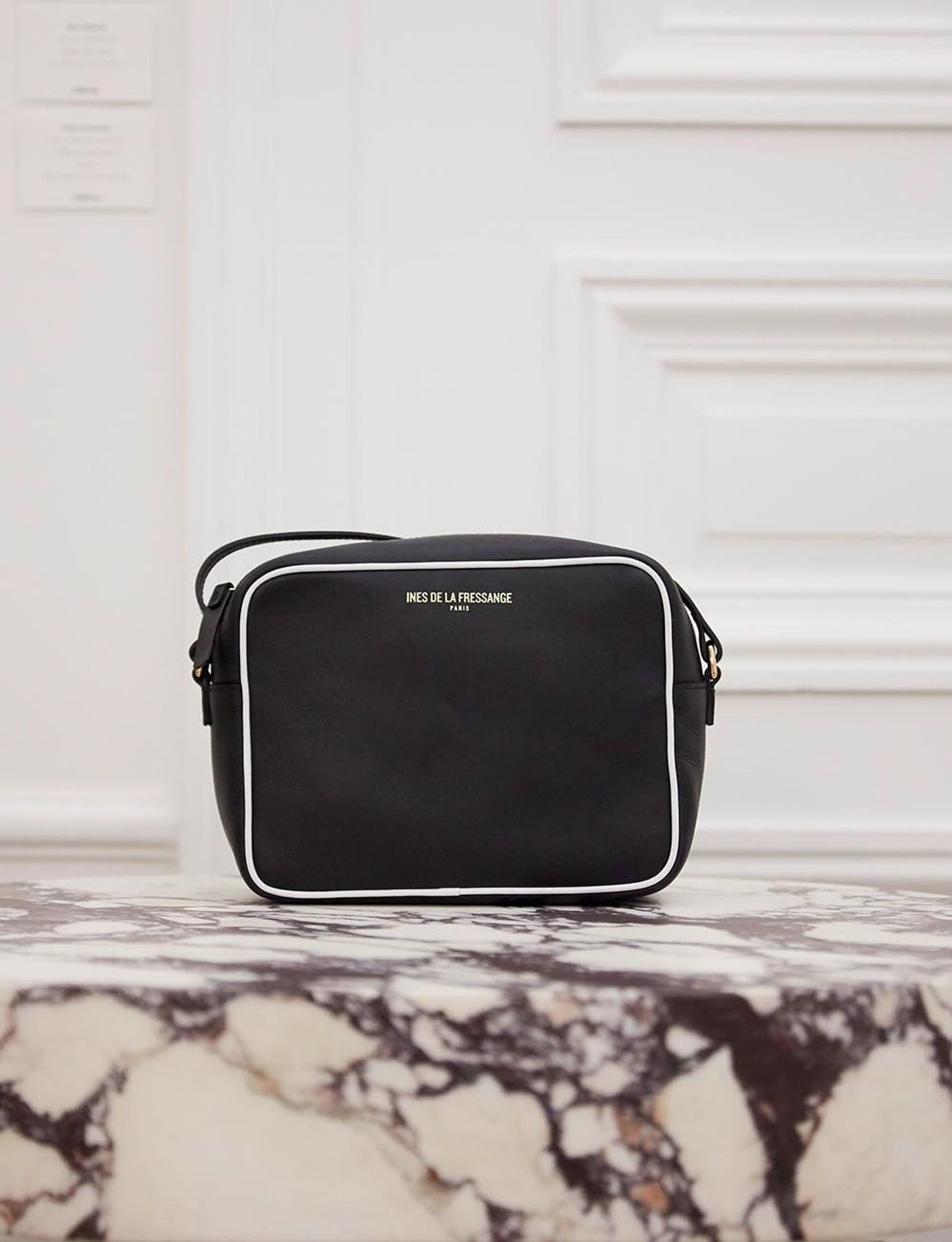 Marcia black leather bag with white trim