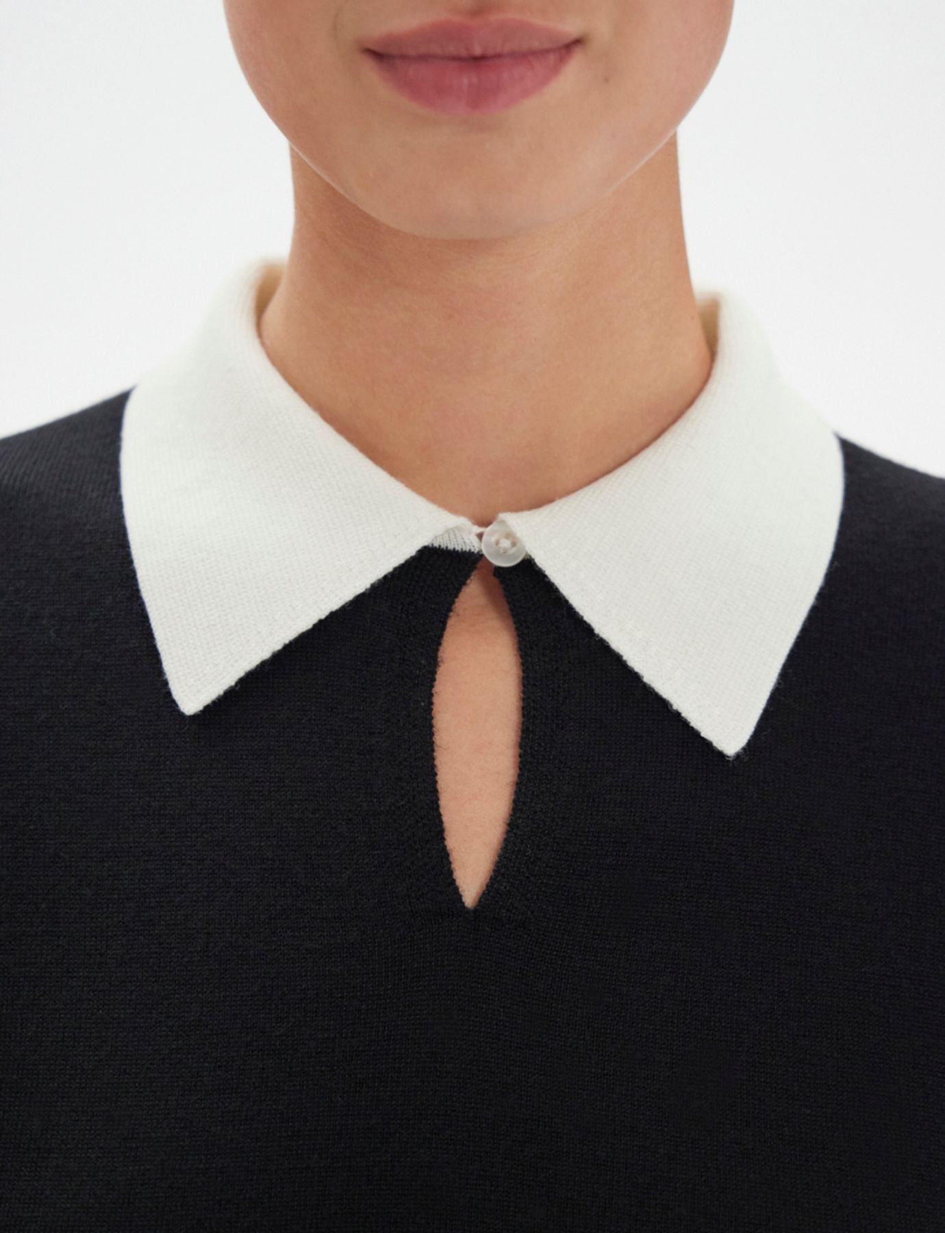 Gabby dress in black merino wool, white cuffs